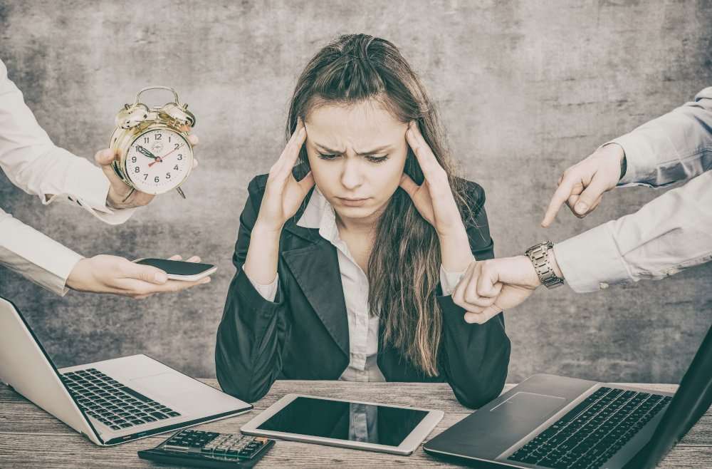 Female office worker is tired of work and exhausted.