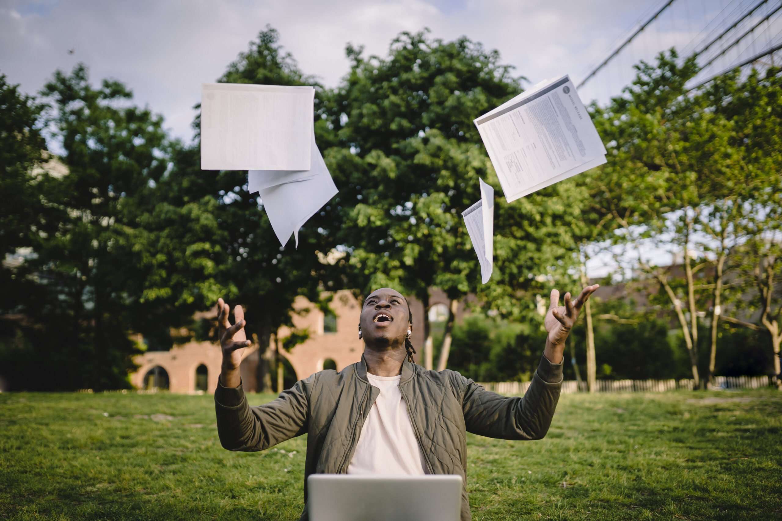 man throwing pdf types into the air