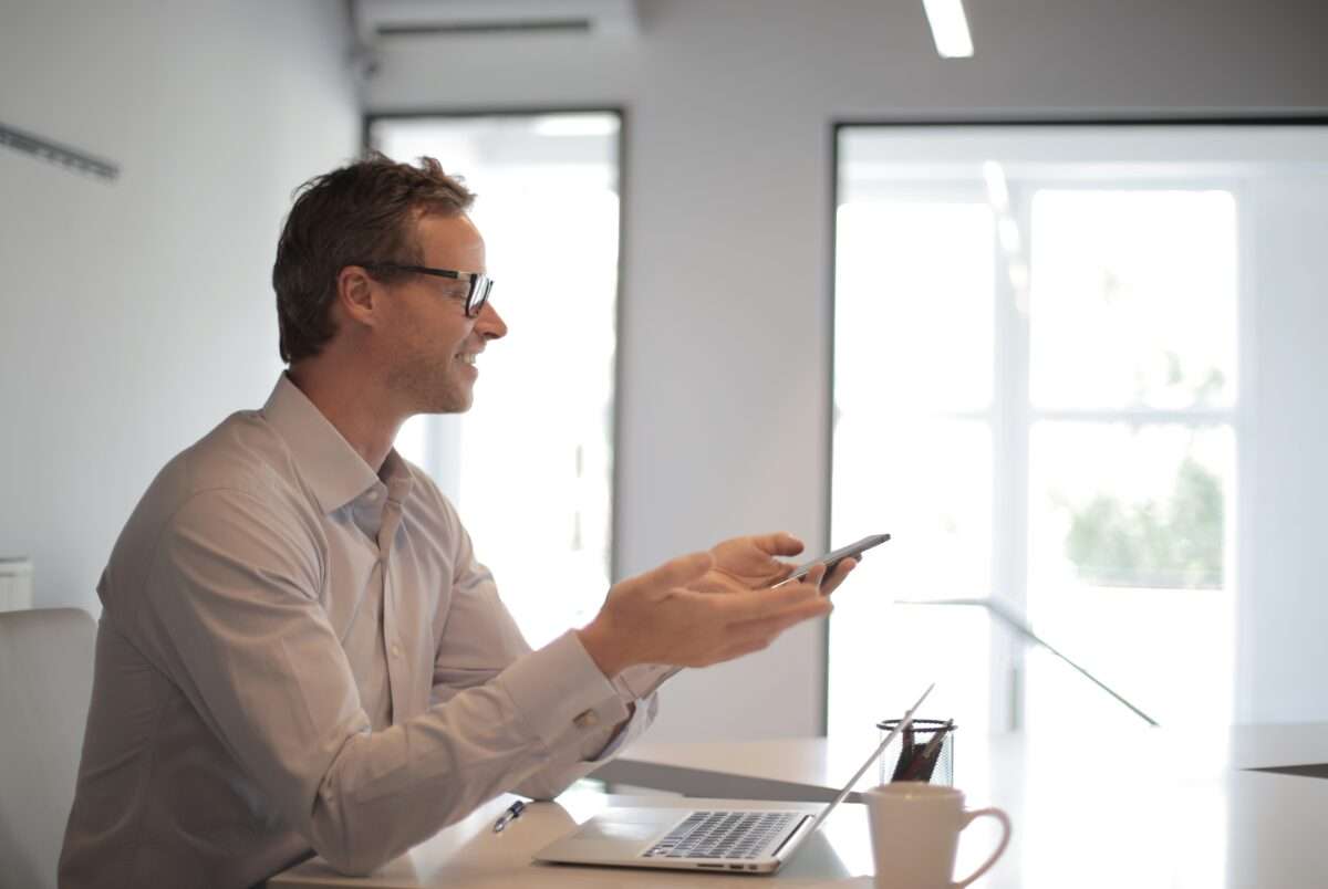 Man working with paper bundles