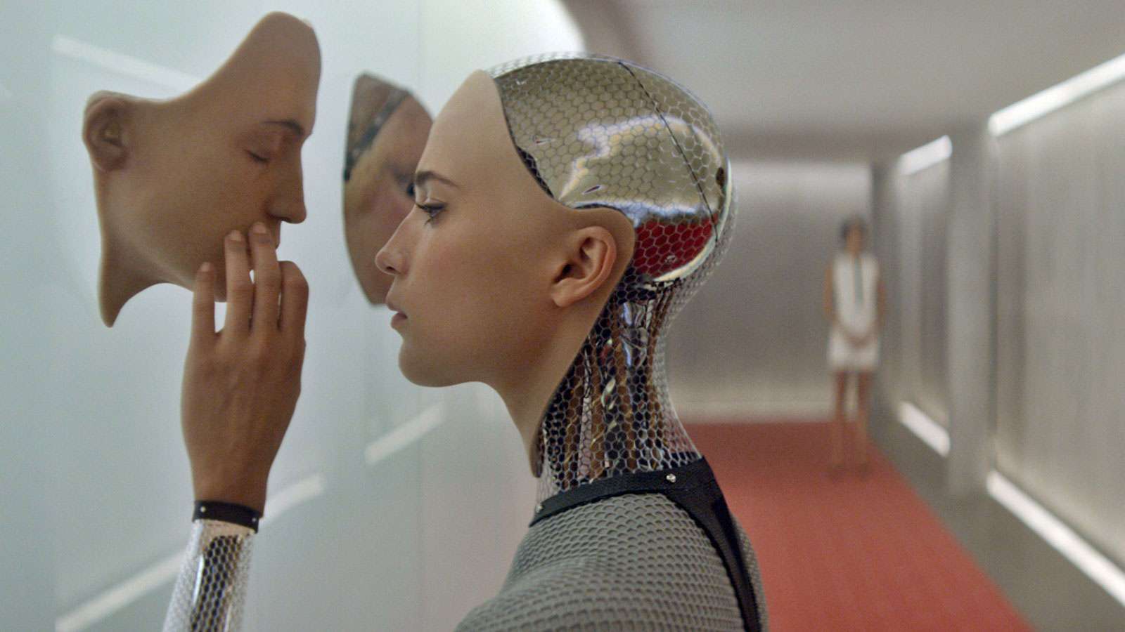 advanced ai model touching a synthetic face mounted on a wall