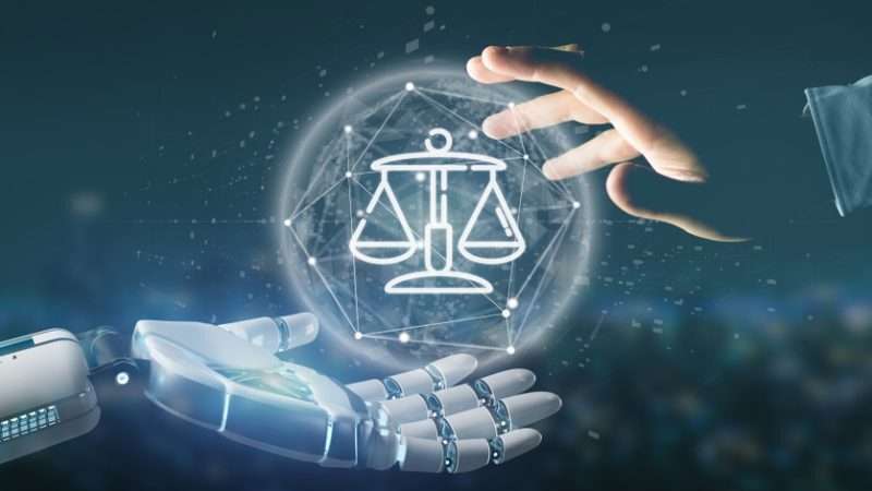 robot hand and human hand holding a holographic justice scale