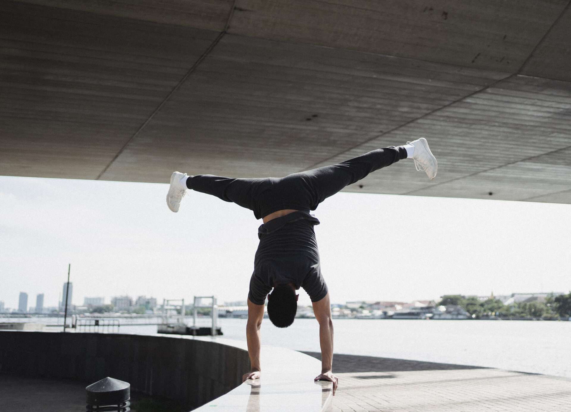 Man doing handstand splits